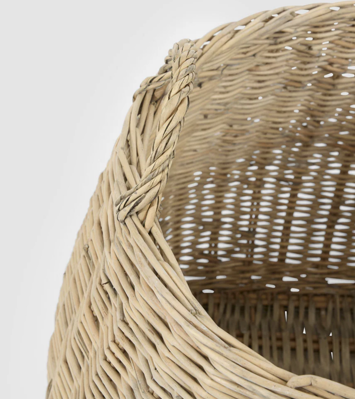 Close-up of the large willow basket rim and woven handle