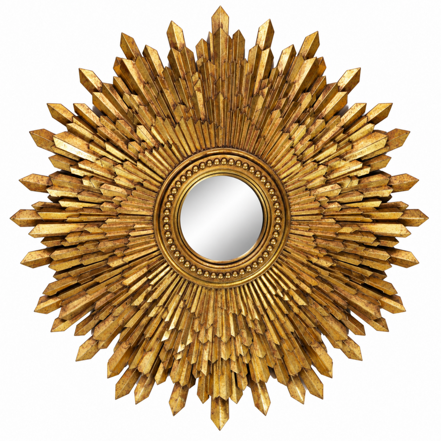 A round decorative wall mirror with an ornate sunburst frame made of many pointed gold-toned rays, shown against a plain white background.