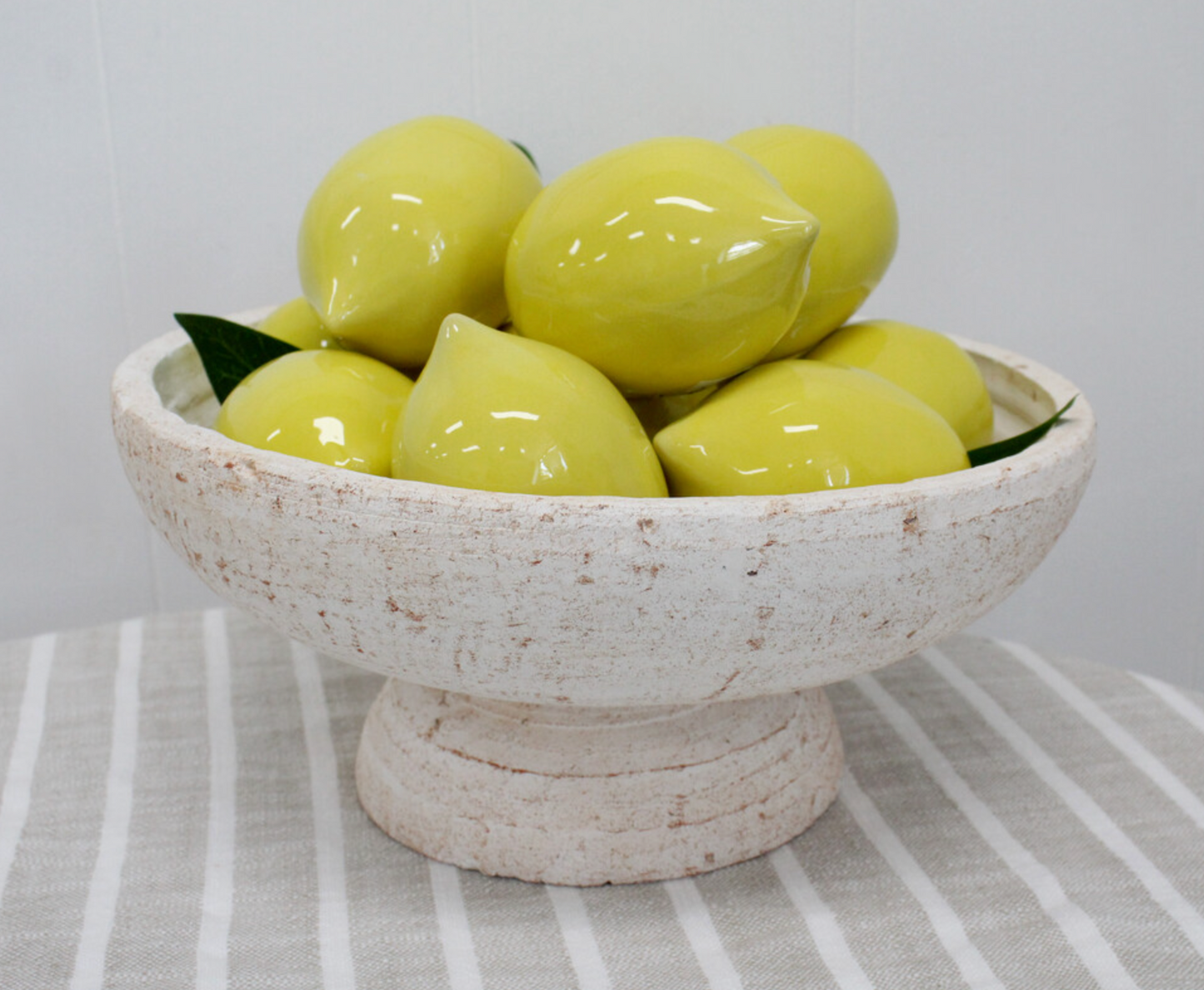 Ceramic lemon centrepiece in ripe yellow glaze