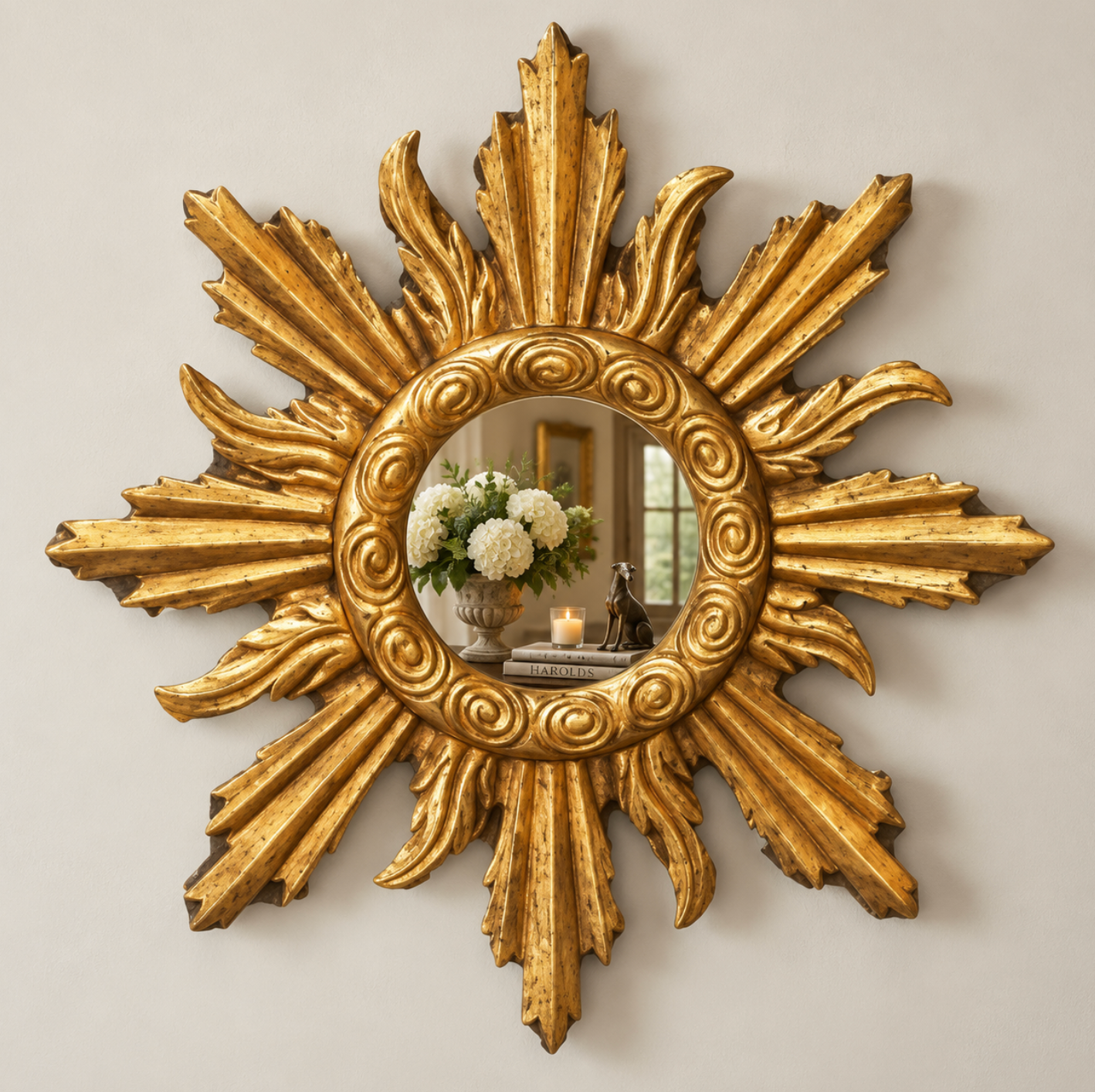 Gold sun-flame mirror with a painted timber frame and sculptural rays