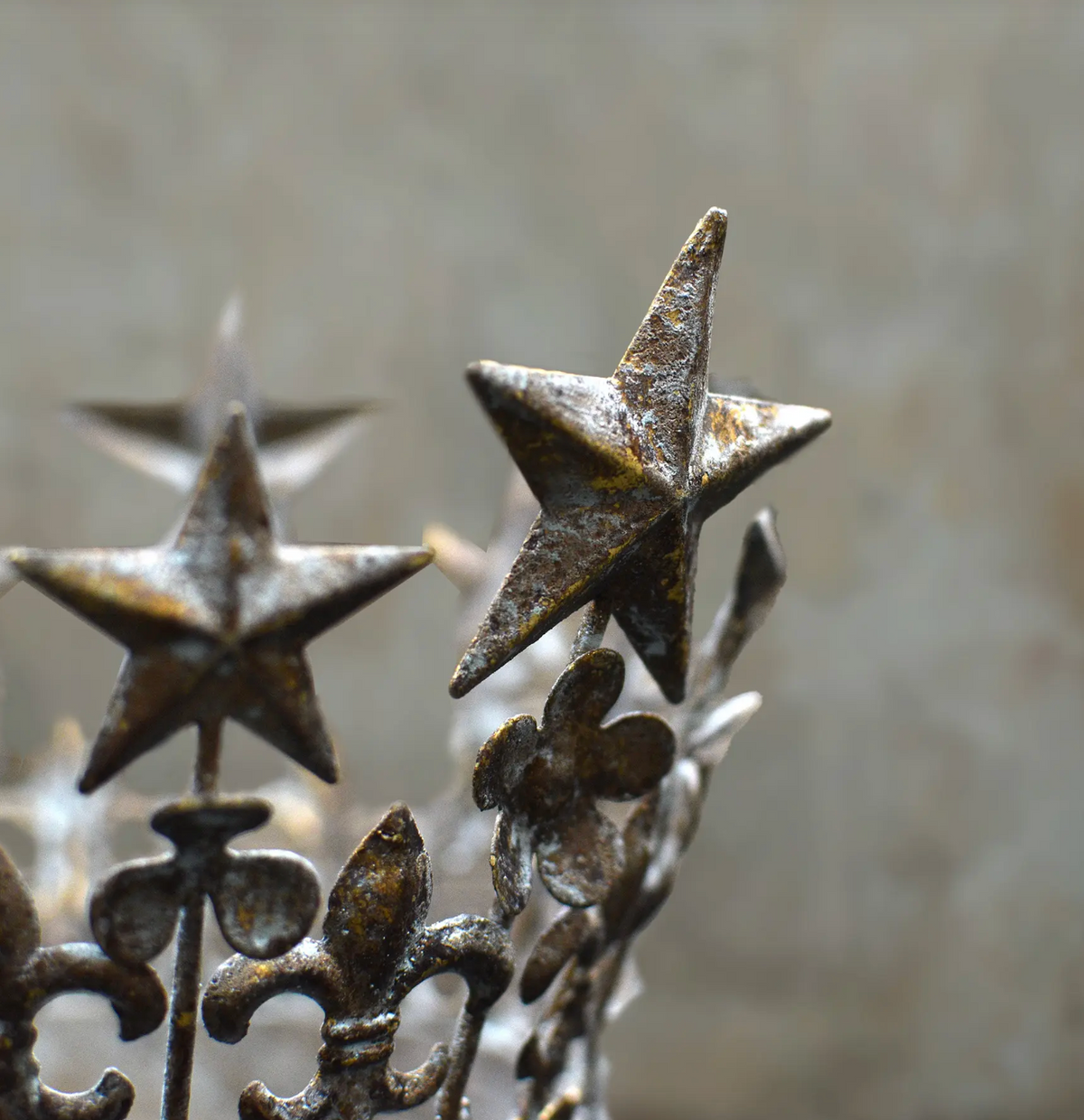 Two crowns with green patina, side by side