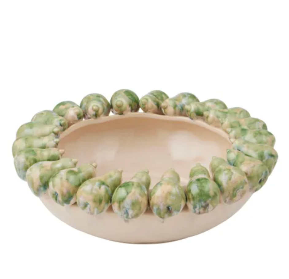 Ivory ceramic bowl with green pebble-textured trim around the rim