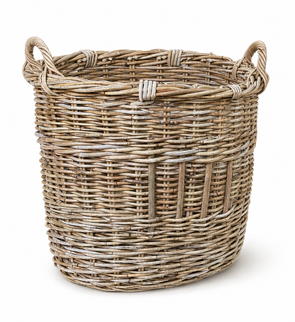 A natural woven wicker basket with two side handles, shown on a clean white background.