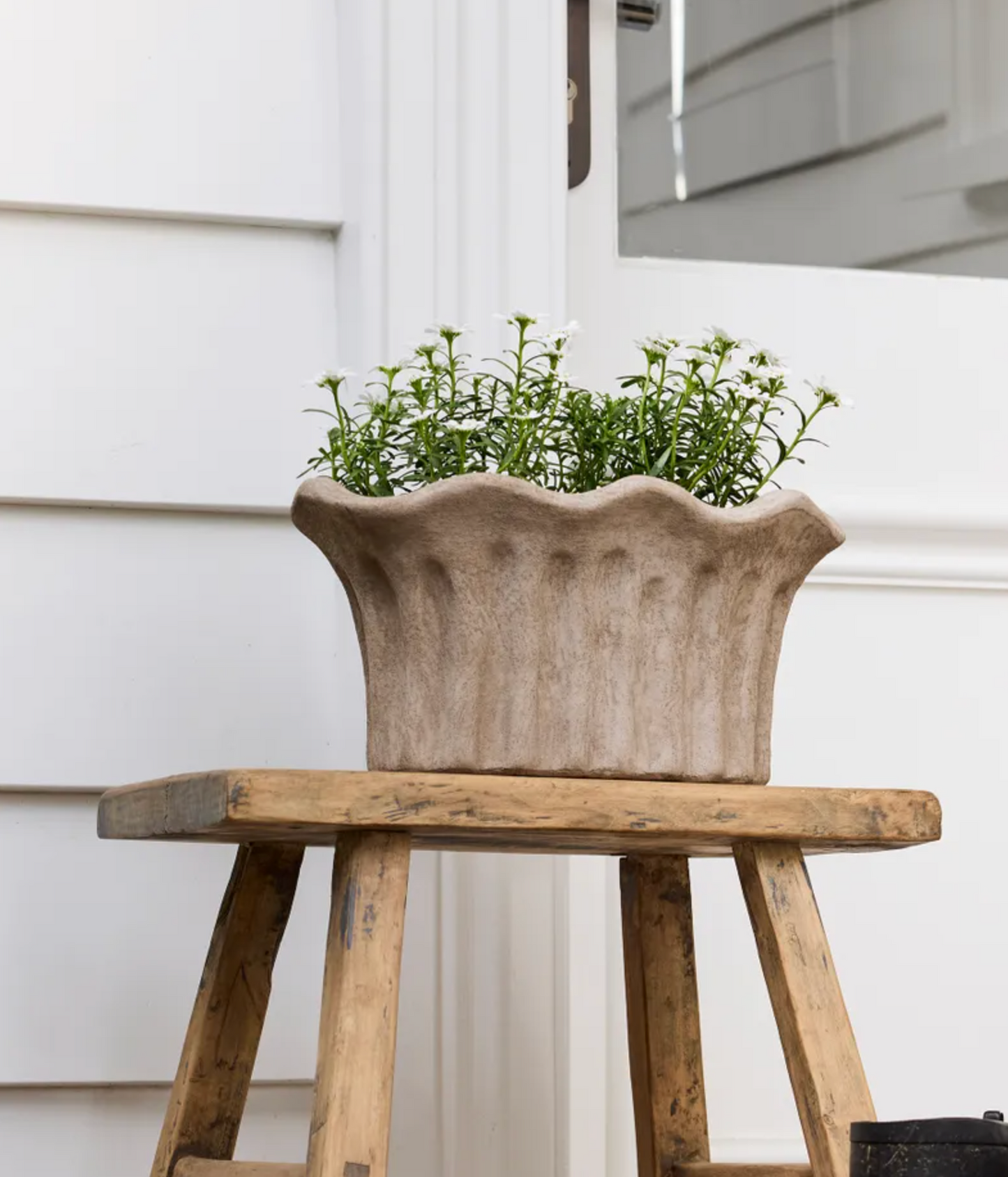 Terra Fluted Oval Planter Small in sand terracotta with white flowers