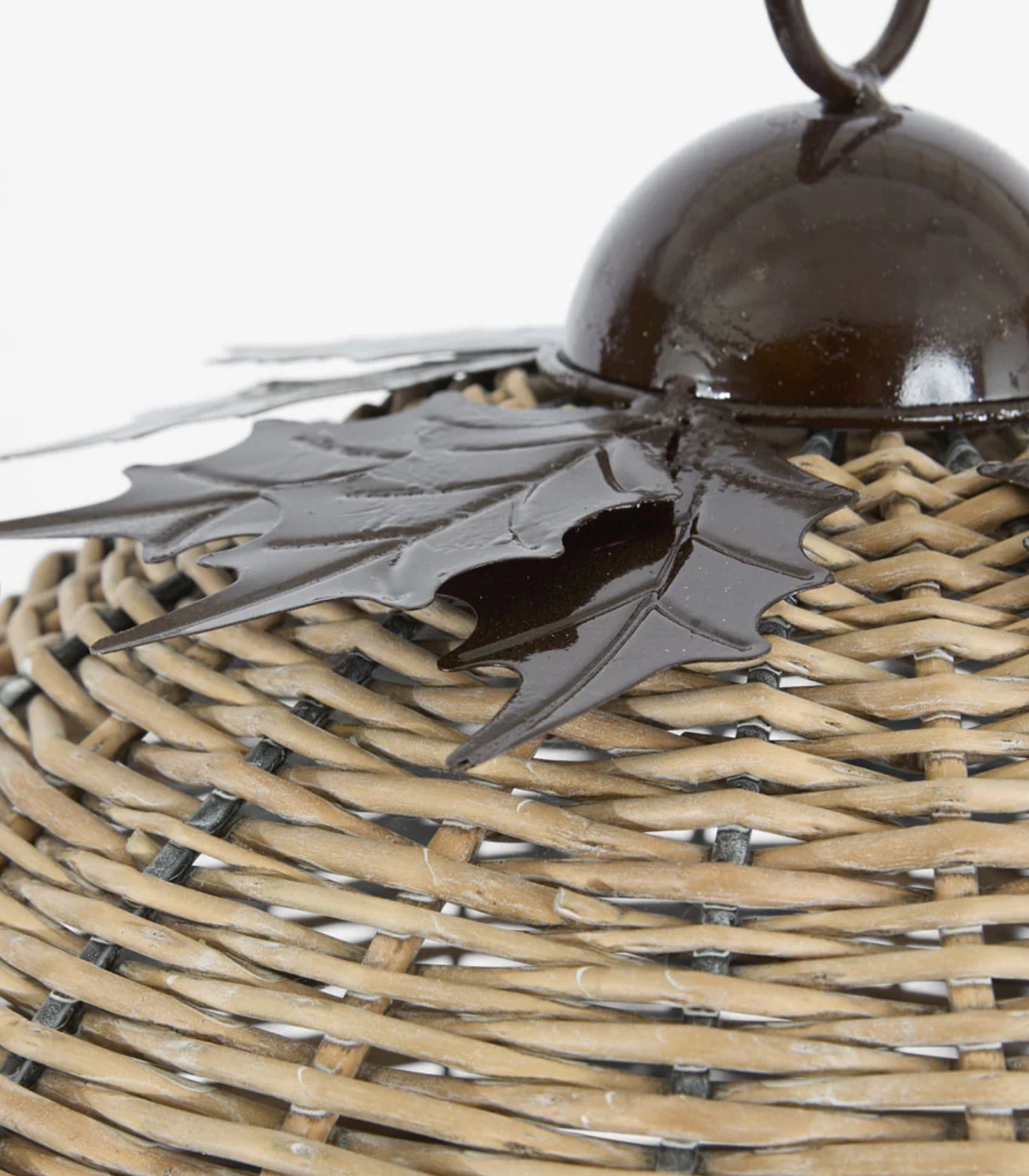 Close-up of dark leaf-shaped crown on large willow bell