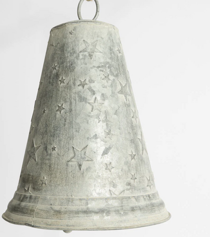 Close-up of large zinc bell with scattered star detailing