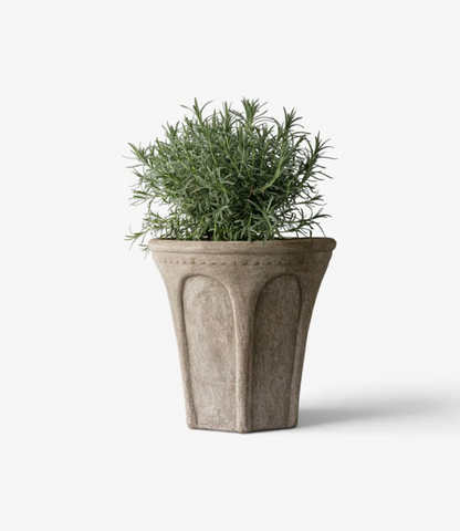 Close-up of the Medium Sand Terra Arc Planter's terracotta rim and sculpted arch-inspired panel.