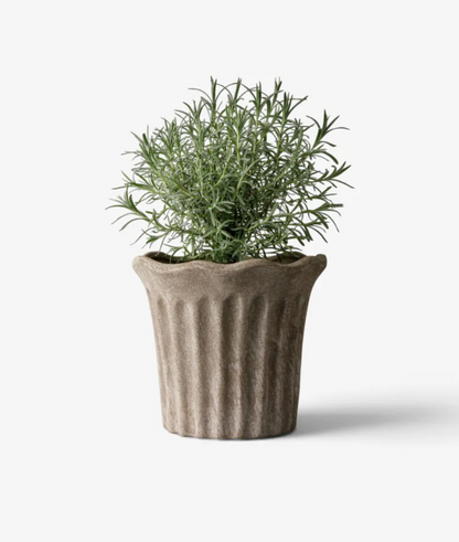 Close-up of the Sand fluted terracotta planter rim and fluted texture