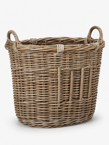 A natural woven wicker storage basket with two loop handles, shown on a clean white background.