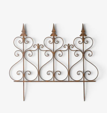 An ornate wrought iron decorative fence panel with three pointed finials and scrolled details, shown against a plain white background.