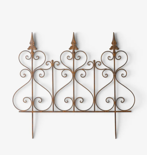 An ornate wrought iron decorative fence panel with three pointed finials and scrolled details, shown against a plain white background.