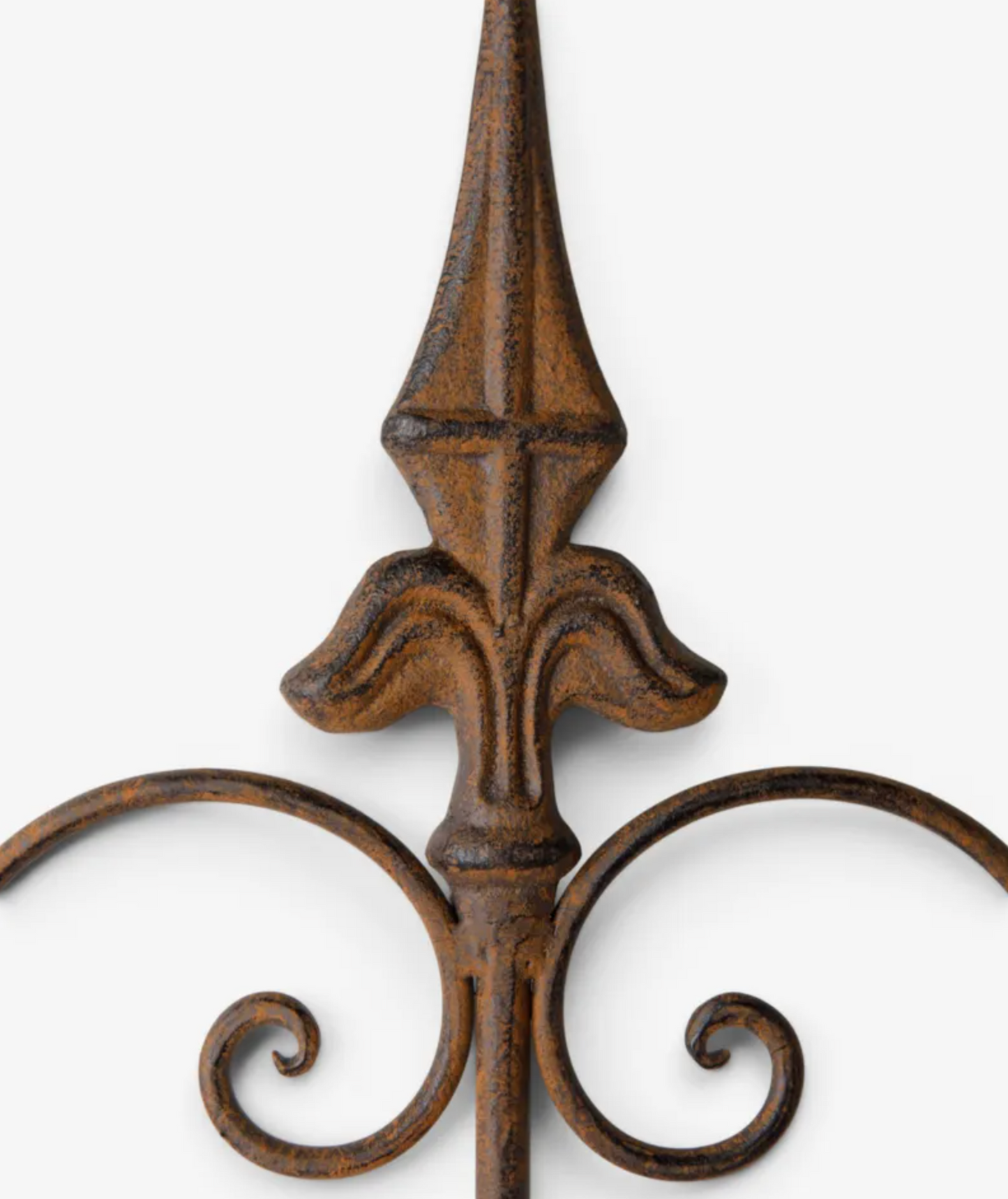 Close-up of a decorative wrought iron fence post with a textured, distressed brown finish and ornate scrollwork at the base, set against a plain light gray background.