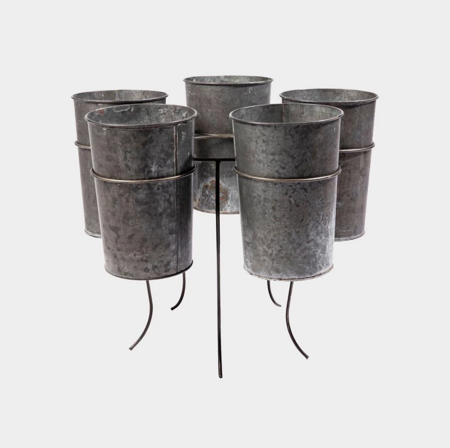 A set of six galvanized metal planters arranged in two rows on a black metal stand with curved legs, photographed against a light gray background.