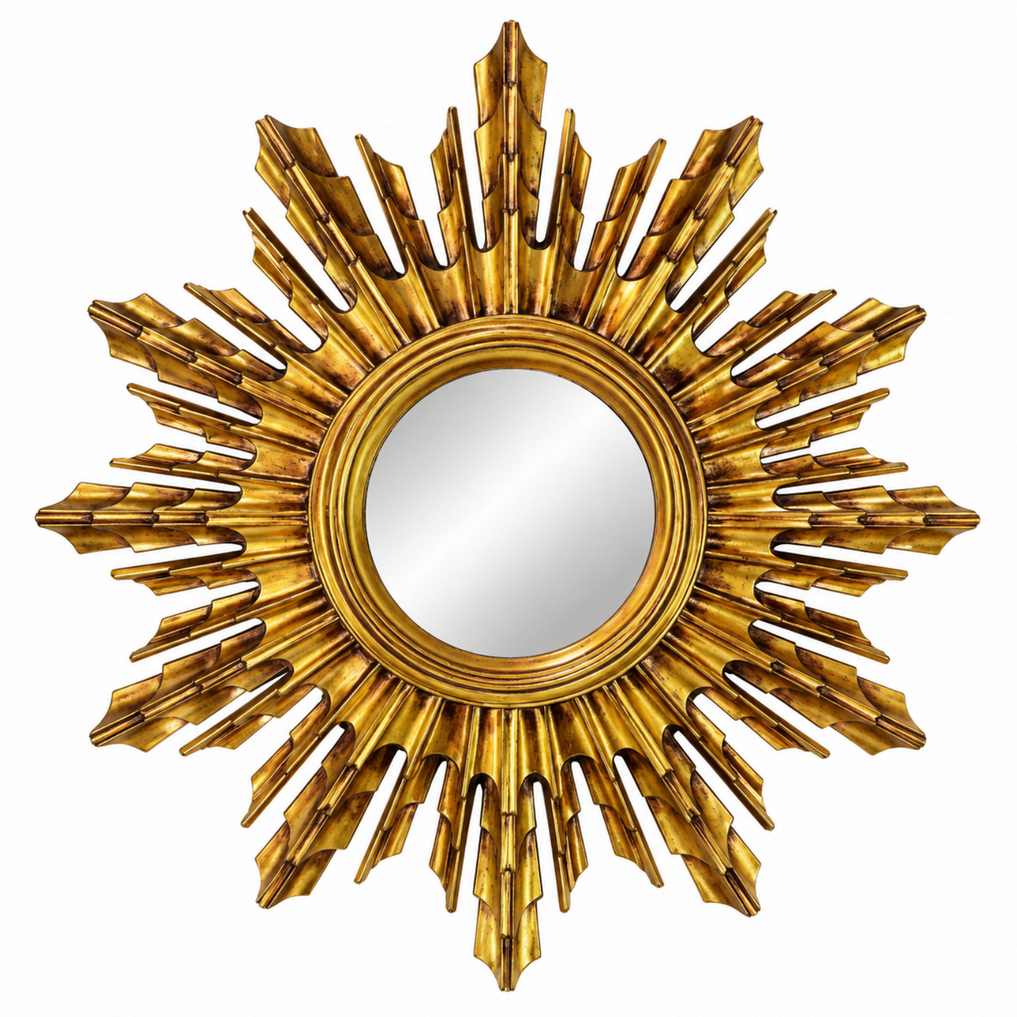 A round wall mirror with an ornate, sculptural sunburst frame in a metallic gold finish, isolated on a white background.