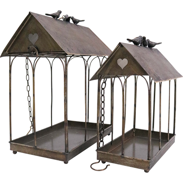 Set of two decorative iron bird feeder houses in aged dark bronze with pitched roof and perched birds