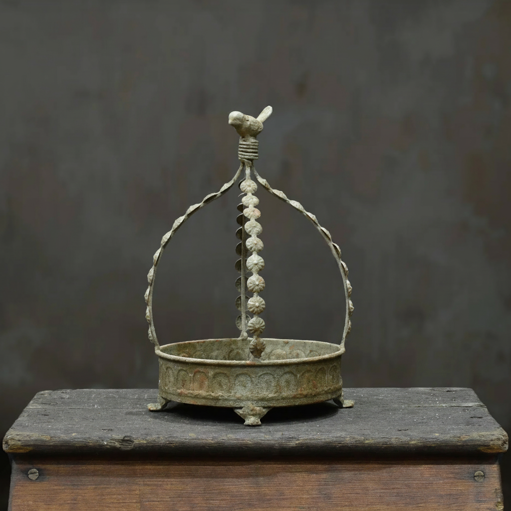 Avilia Bird Planter in Blanca finish - side profile showing embossed body and footed base