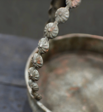 Close detail of beaded stem and arched handle on the Avilia Bird Planter