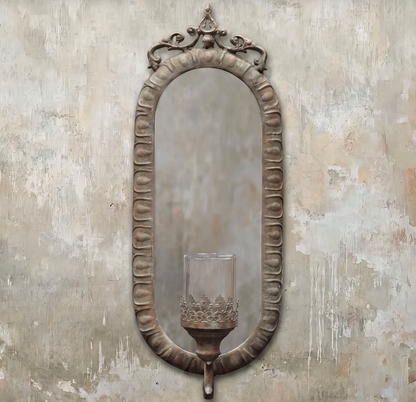 Candelero Wall Mirror Candle Sconce in Oxido finish showing full length with arched frame and cast metal candle bracket