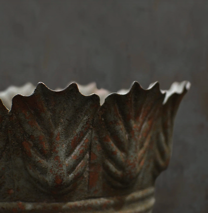 Close detail of Carla Fluted Bowl leaf-edged rim in aged Oxido finish