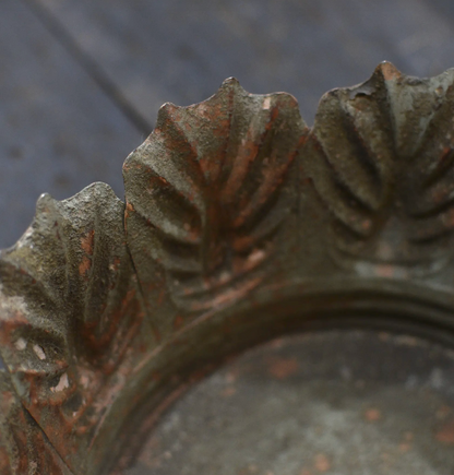Close detail of Carla Fluted Bowl decorative leaf rim and fluted body in aged patina