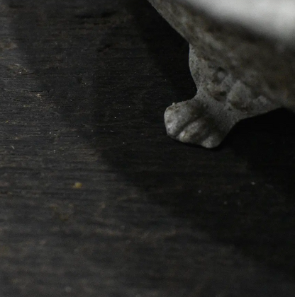 Cast iron bird dish in aged Blanca patina - side profile showing iron feet and embossed body