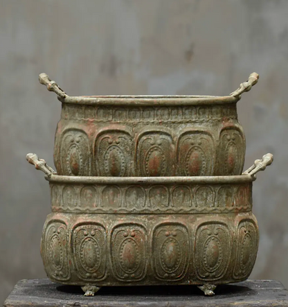 Close detail of small claw foot on base of embossed trough planter