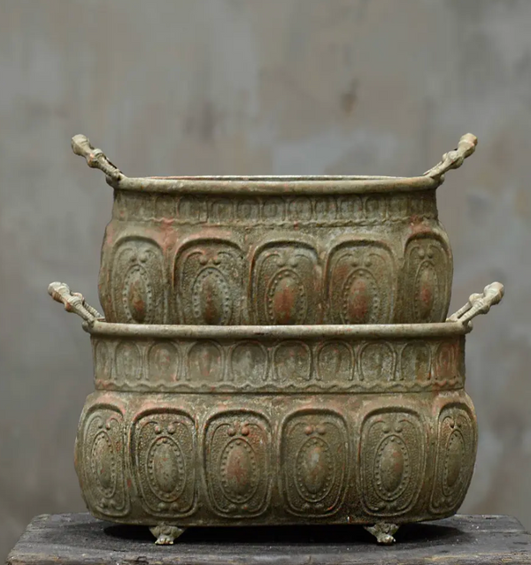 Close detail of small claw foot on base of embossed trough planter