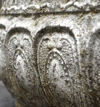 Close detail of embossed body texture and weathered patina on trough planter