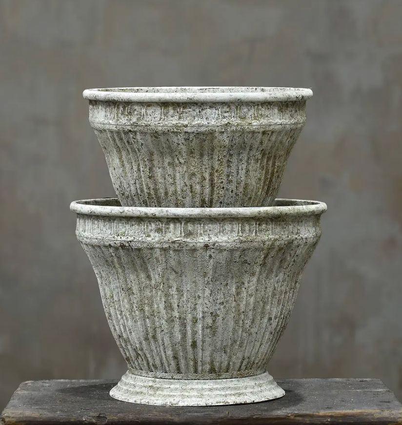 Single fluted metal planter in aged Oxido patina showing ribbed body and beaded rim band