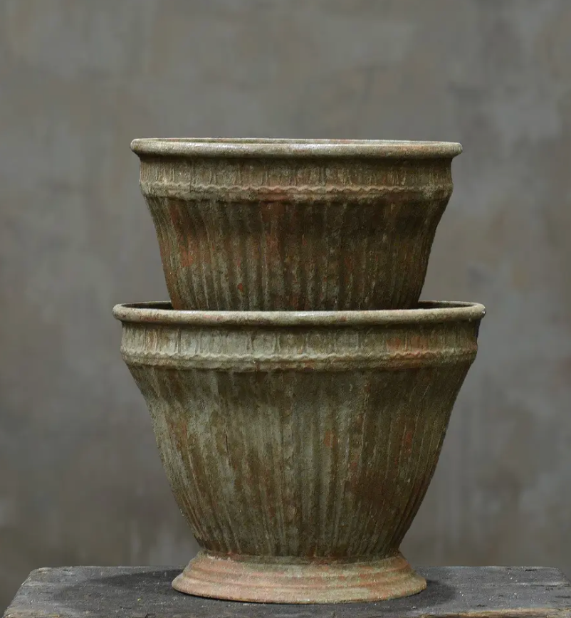 Close detail of beaded rim band and vertically ribbed body on fluted planter in aged Blanca patina