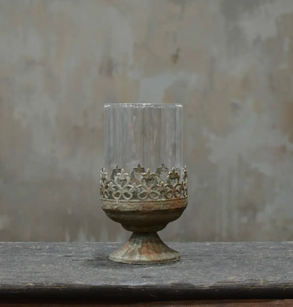 Small footed metal crown candle holder in aged Oxido patina showing darker weathered finish