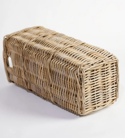 Kubu cane umbrella stand laid on its side showing base construction and woven underside
