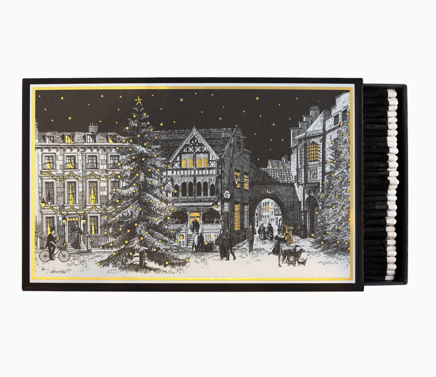 Starry Night giant matchbox open showing 150 black-tipped white matchsticks and illustrated Victorian Christmas town square with decorated tree and gold stars