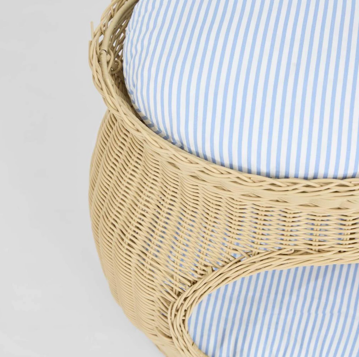 Rattan Pet Bed close up detail of woven PE rattan and stripe cushion top