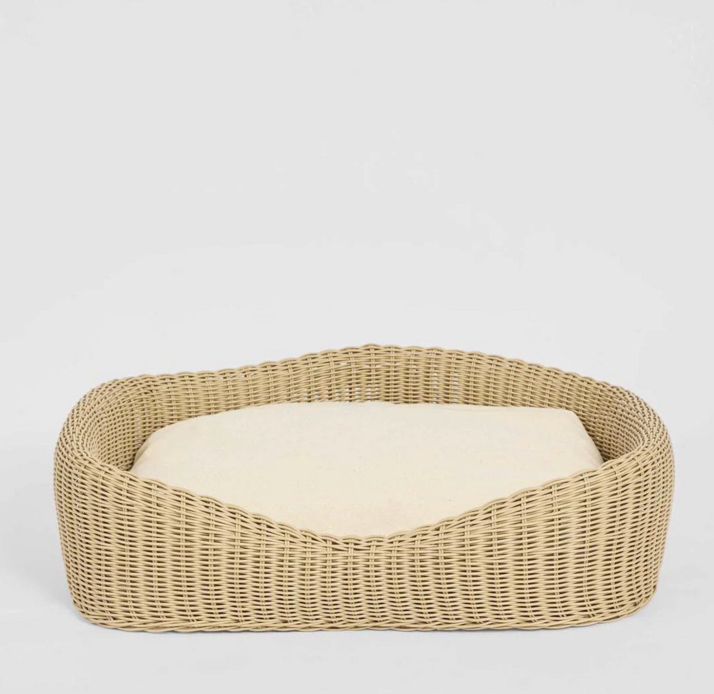 Rattan Pet Bed in natural PE rattan with cream cushion - front view