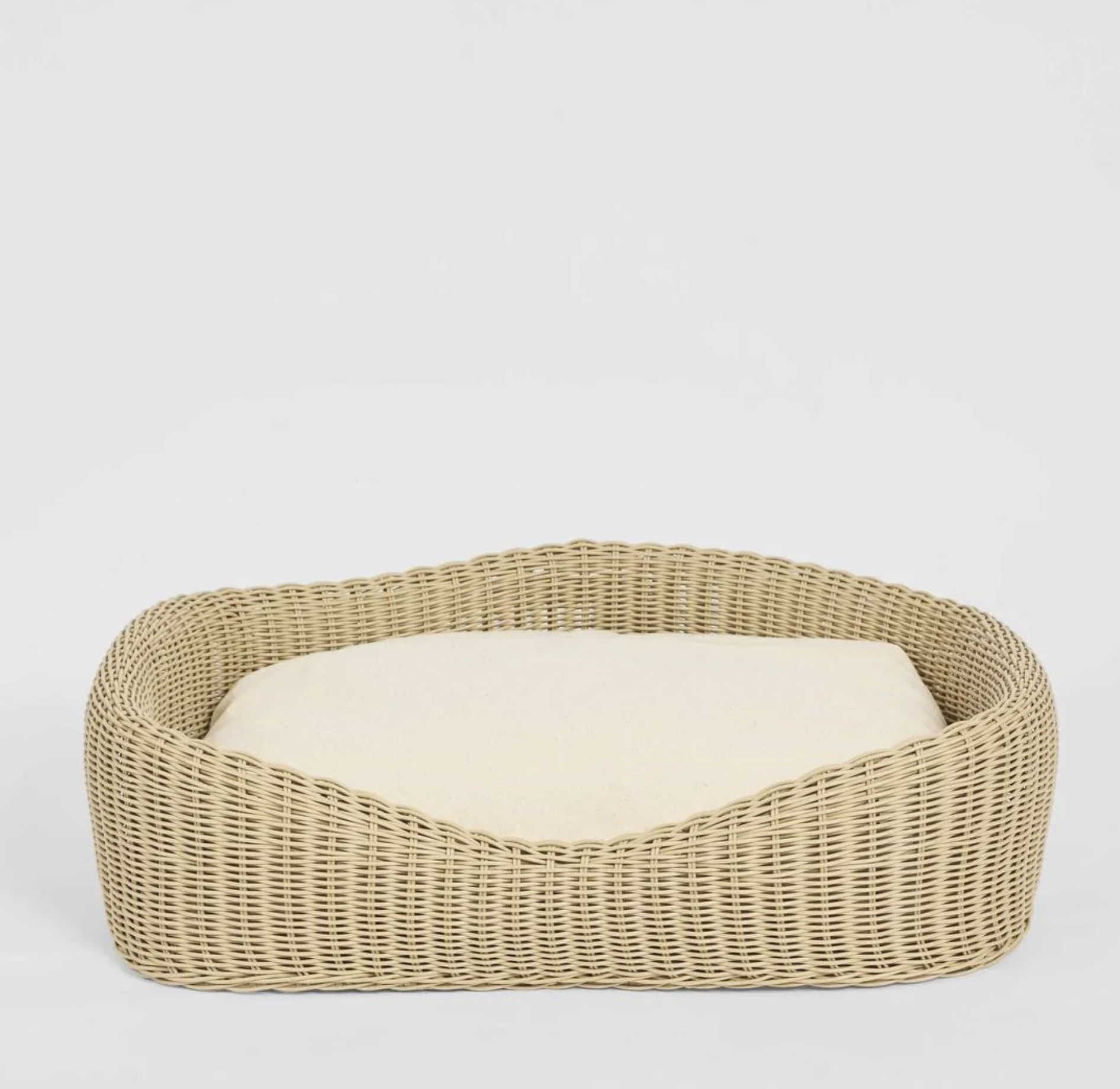 Rattan Pet Bed in natural PE rattan with cream cushion - front view