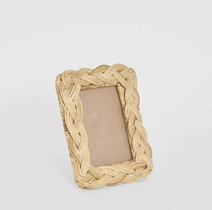 Braided Rattan Photo Frame in natural standing on shelf - angled view
