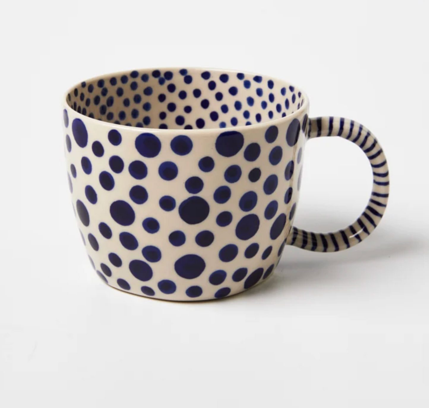 Jones and Co Chino Mug in navy spot, hand-painted polka dot pattern on white ceramic with striped handle