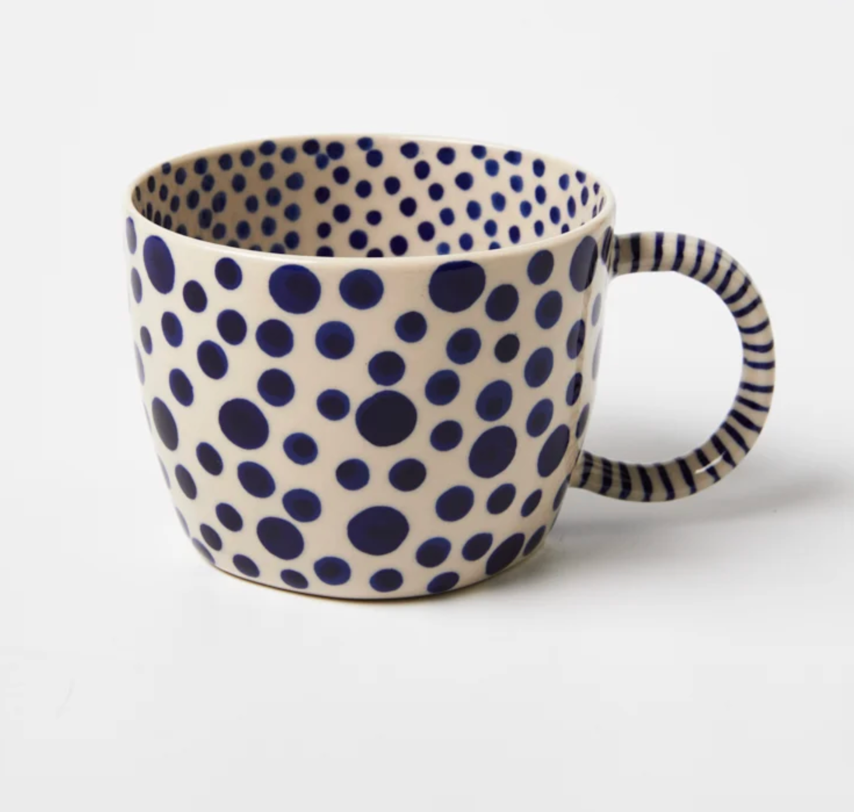 Jones and Co Chino Mug in navy spot, hand-painted polka dot pattern on white ceramic with striped handle
