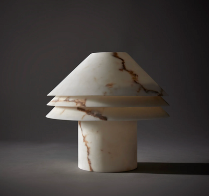 Faux alabaster tiered table lamp on white background showing full form