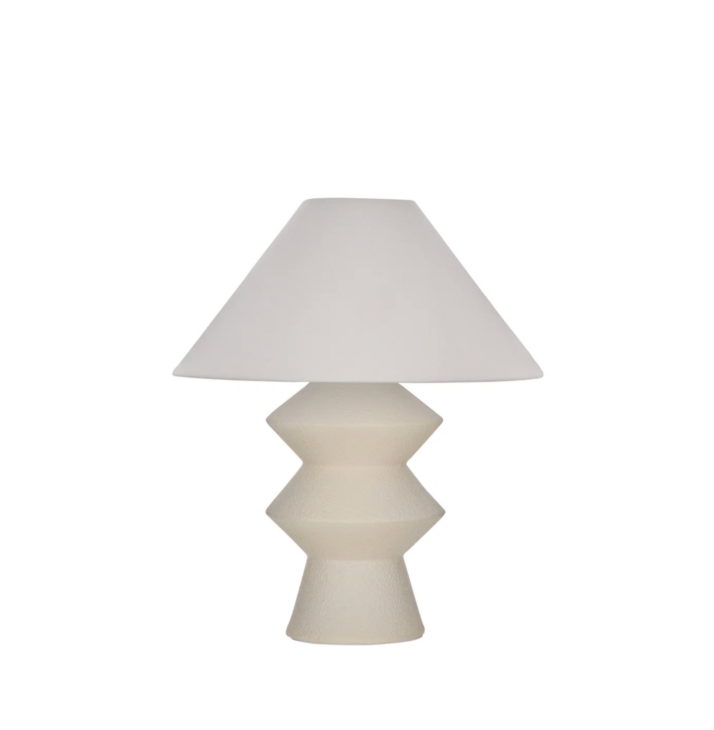 White geometric fiberglass table lamp with linen shade on white background