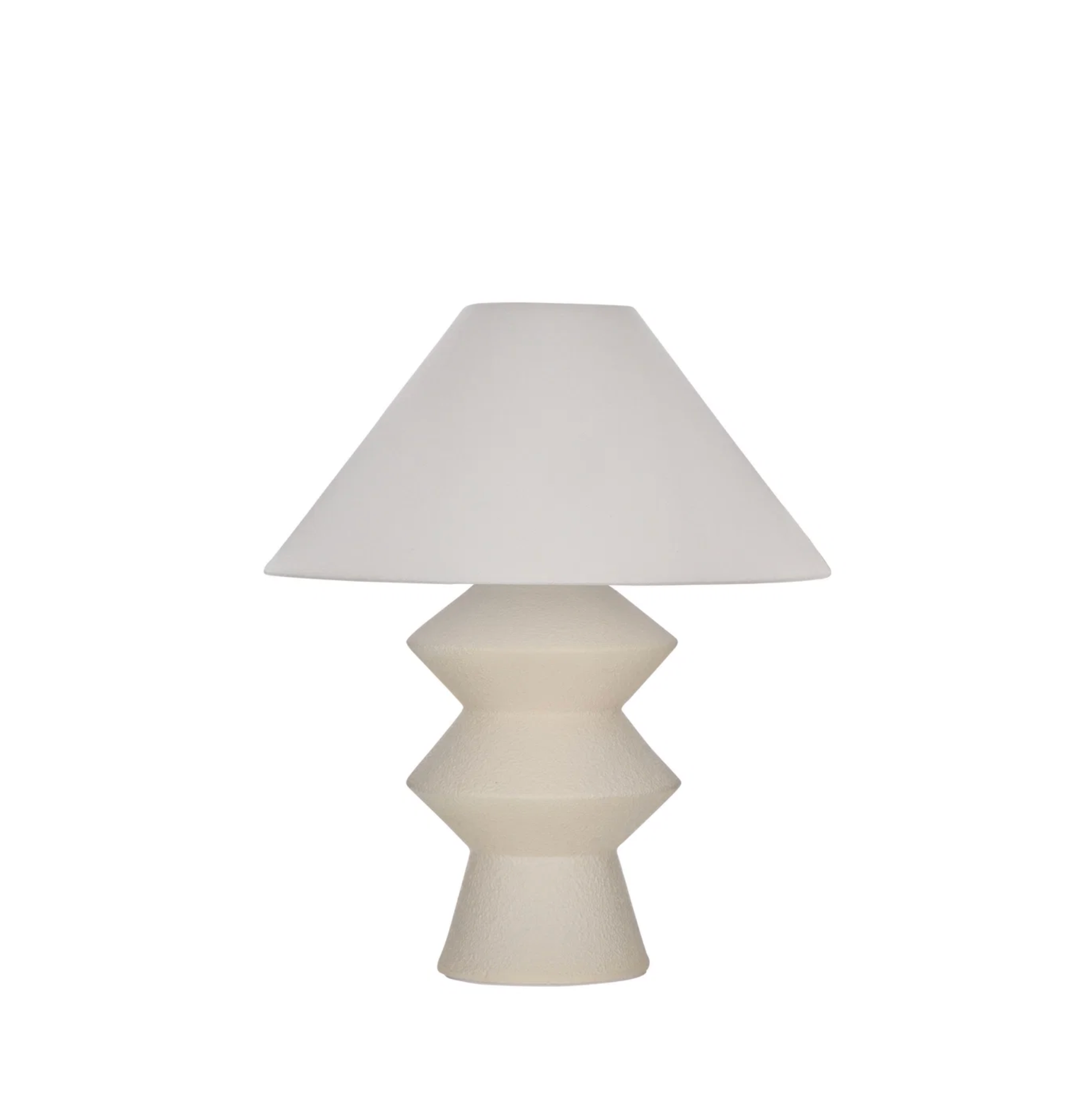White geometric fiberglass table lamp with linen shade on white background