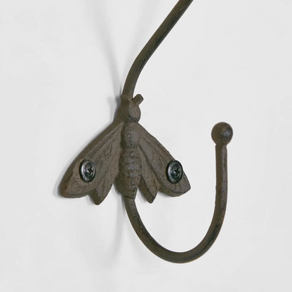 Cast Iron Bee Wall Hook in aged brown - close up detail of bee motif and wall mount screws