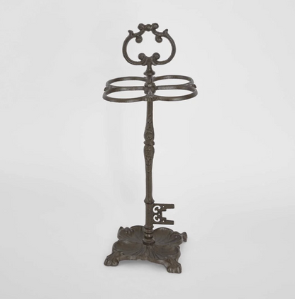 Cast Iron Umbrella Stand in dark aged finish - front view showing scrolled crest and four oval rings