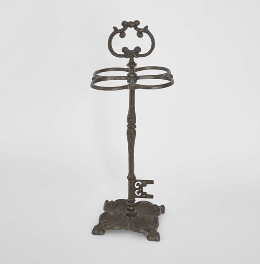 Cast Iron Umbrella Stand in dark aged finish - front view showing scrolled crest and four oval rings