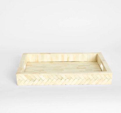 Bone inlay tray styled on dining table with decorative objects
