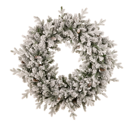 Snow-flocked Christmas wreath with pine cones