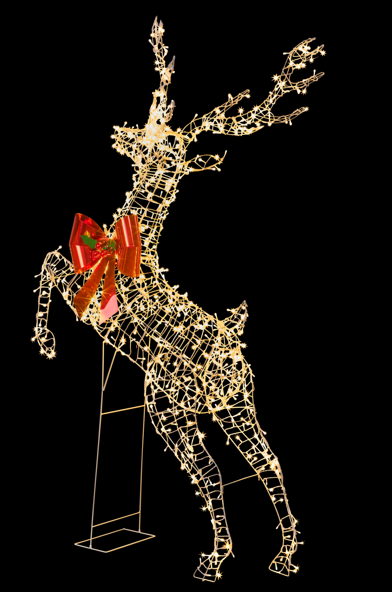 Light-up rearing reindeer with warm white twinkle lights and red bow