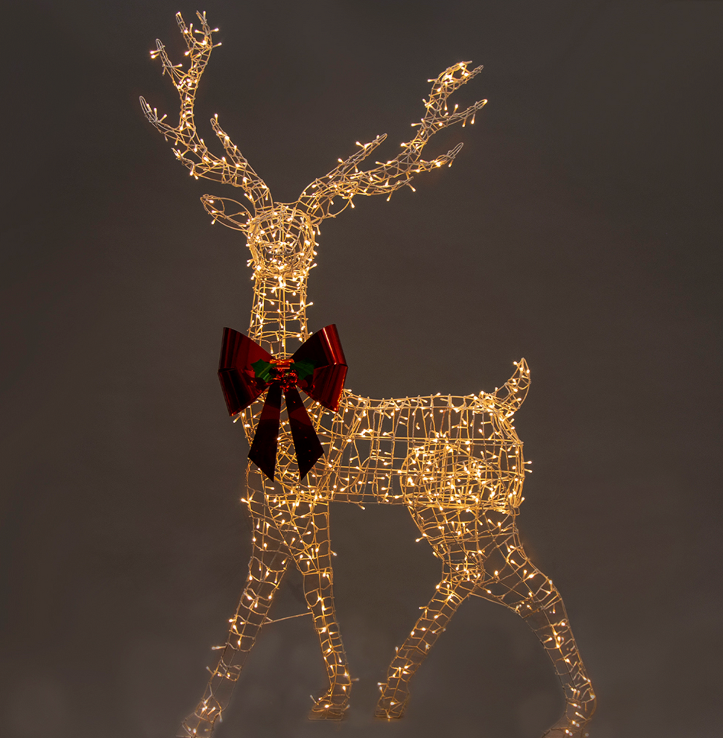 Light reindeer with twinkle lights and red bow
