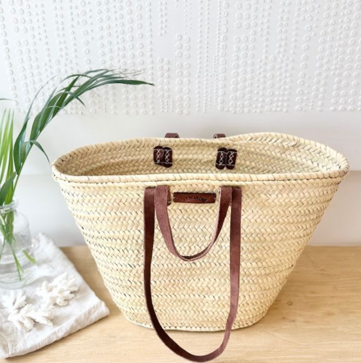 Tan palm leaf market basket with genuine leather handles